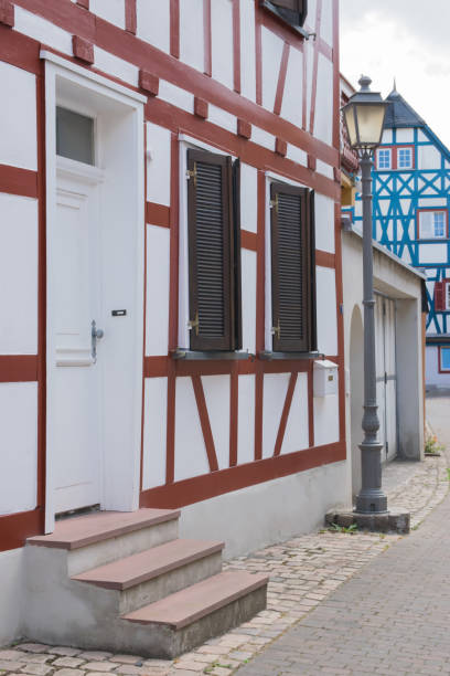 istock Window and brown door on old traditional house 1853054302