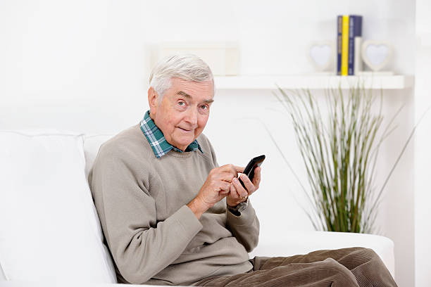 istock Cheeky Looking Senior Man Using A Mobile/ Smart Phone 185305786
