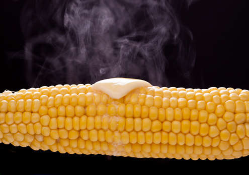 Steamed sweetcorn on the cob with melting butter