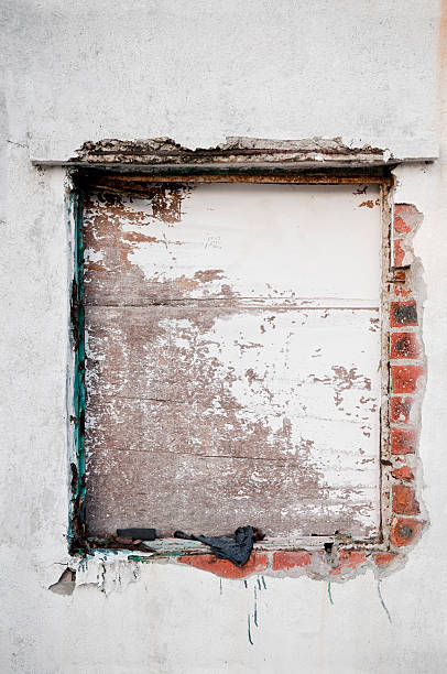 istock Abandoned Window Covered with Wood Panels 185306093