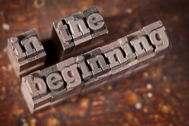 IN THE BEGINNING Written With Old Letterpress stock photo