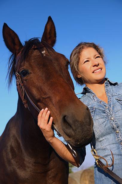 istock Farm girl with horse 185306146