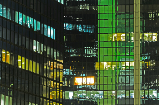 Colorful modern office building exterior in night.