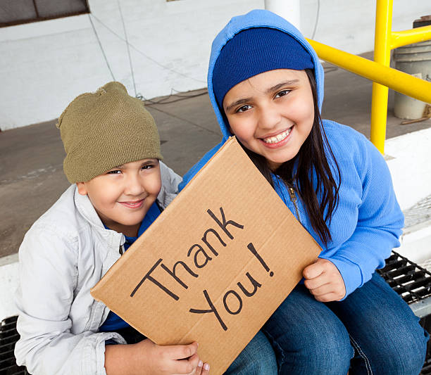 istock kids holding a thank you sign 185307624