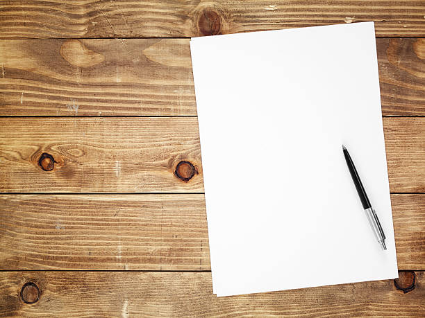 istock Directly above view of a papers on wooden table 185307753