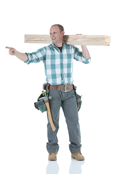 istock Carpenter carrying wooden planks 185307896