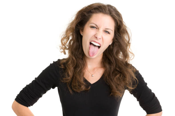 istock Young Woman Sticking Out Tongue 185308221