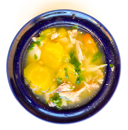 High angle view of chicken soup with vegetable ready to eat for lunch at home.