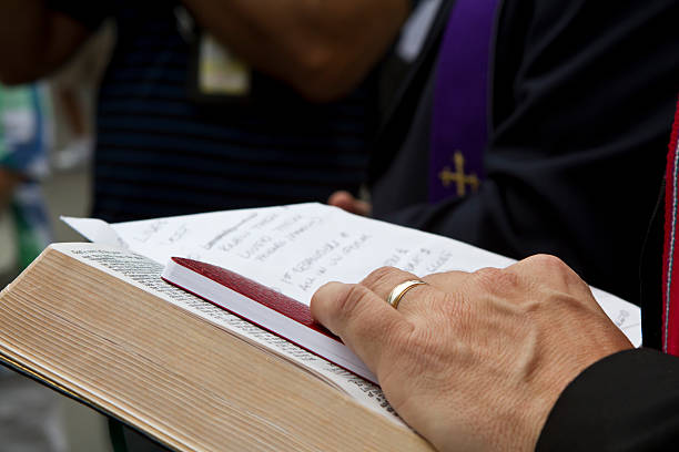 istock Religion Priest Human Hand With Bible 185308422