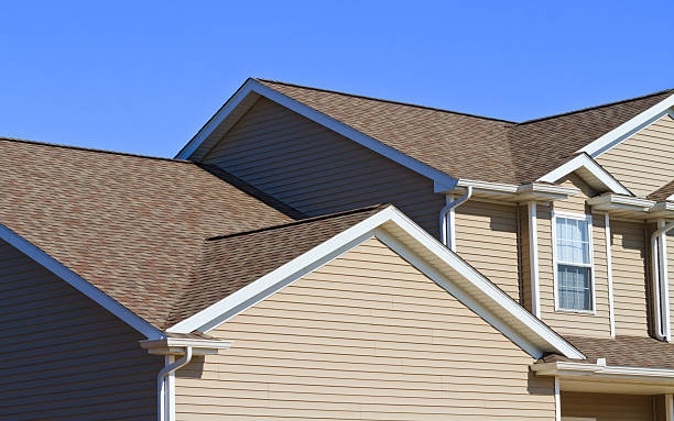 istock New home construction,showing siding,roof,and gutters 185308519