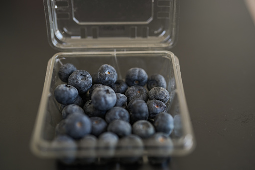 blueberries in a transparent plastic box