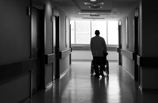 Nurse Pushing patient Sitting in Wheelchair