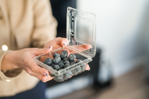 blueberries in a transparent plastic box