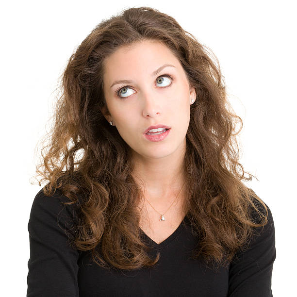 Annoyed Young Woman Rolling Eyes Portrait of a young woman on a white background. http://s3.amazonaws.com/drbimages/m/ap.jpg rolling eyes irritation displeased facial expression stock pictures, royalty-free photos & images