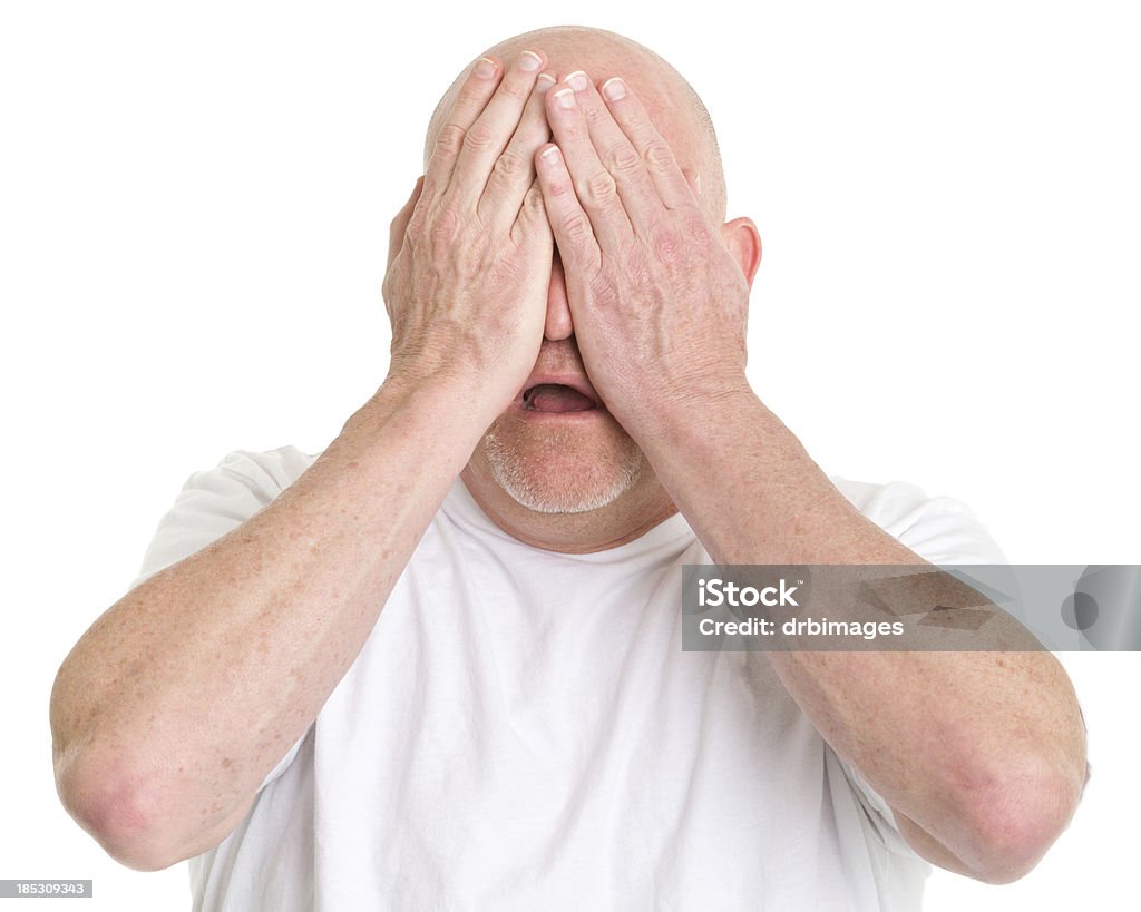 Worried Man Covering Eyes Portrait of a mature man on a white background. 40-49 Years Stock Photo