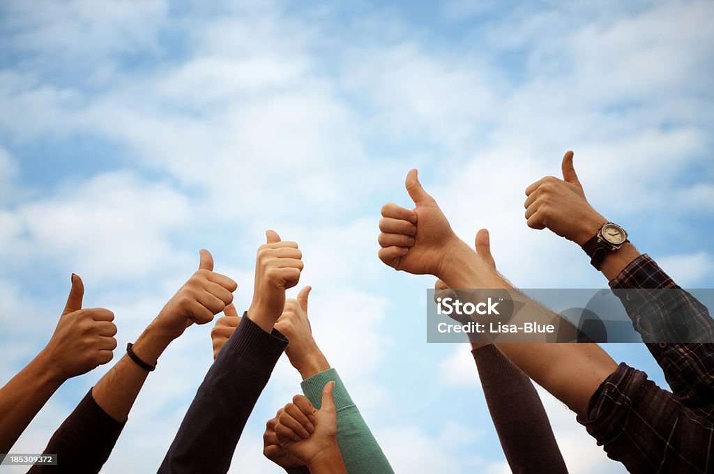 Group Of People Thumbs Up Blue Sky.Copy Space group of people giving thumbs up OK Sign Stock Photo