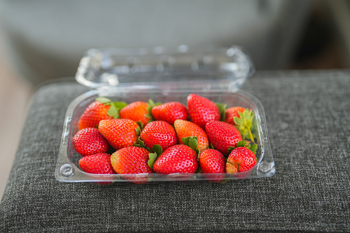 Strawberries in a clear plastic box