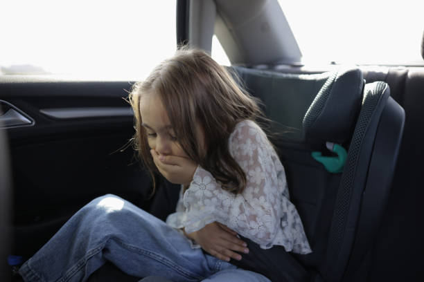 istock Little girl suffers from motion sickness in car 1853095603