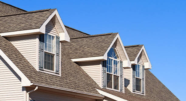 istock New Home showing gables, roof and vinyl siding 185309764