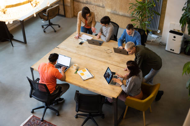 High angle view of multi-ethnic group of coworkers working in a co-working space