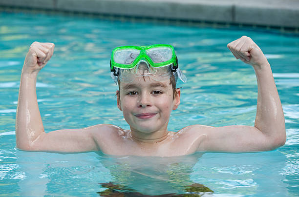 caucasiano feliz menino nadar - golf child sport humor imagens e fotografias de stock