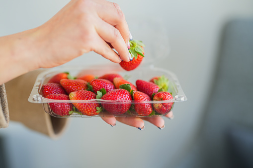 Strawberries in a clear plastic box