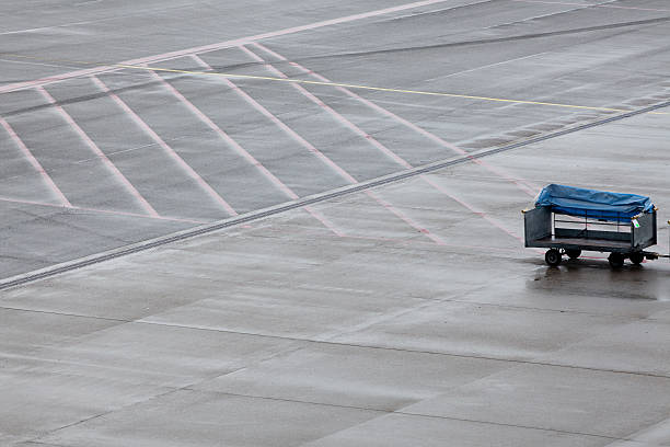 istock baggage trailer on airport runway 185310129