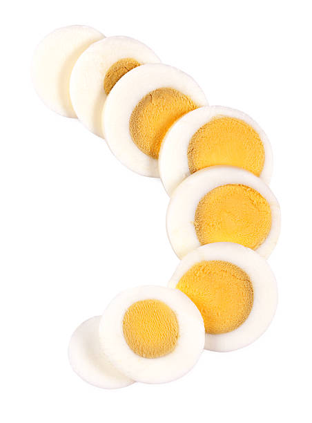 Sliced hard boiled egg Sliced hard boiled egg isolated on white. See also: boiled egg cut out stock pictures, royalty-free photos & images