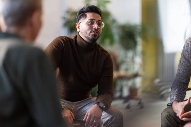 istock Young man during meeting in office brainstorming new ideas 1853103404