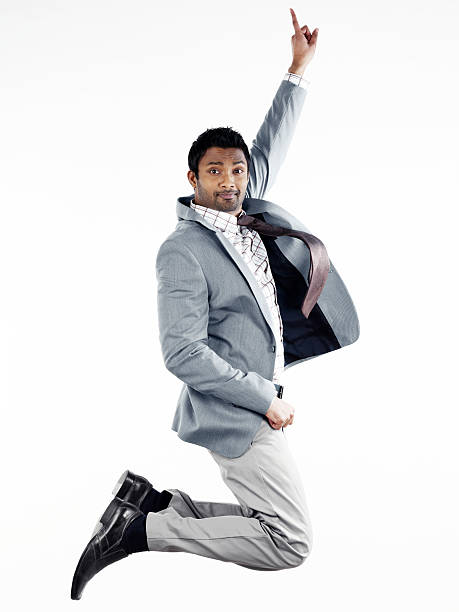 istock Businessman jumping and pointing upward 185310536