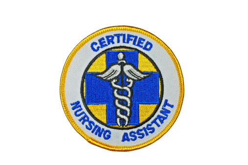 Isolated on white with clipping path.Patch worn by a certified nursing assistant in the medical field.