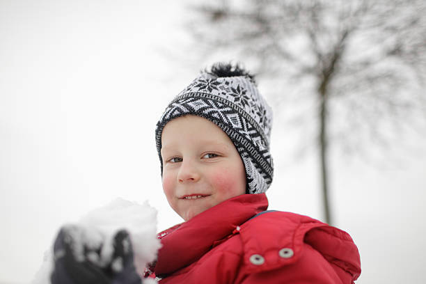 istock little boy and snow 185310923