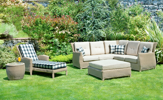 An sofa and chair on lawn at a gardensimilar images:
