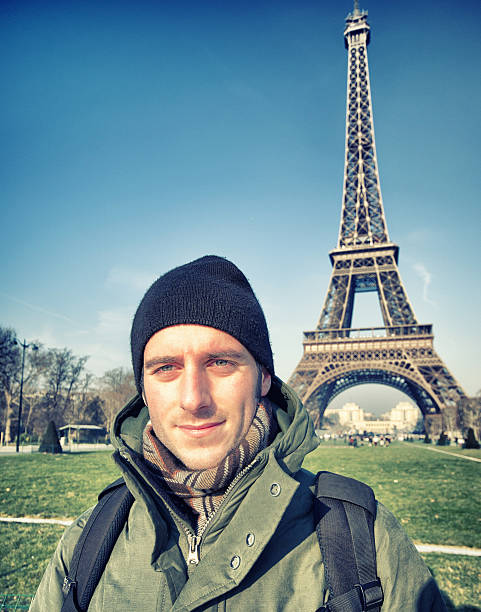 istock young male tourist at Tour Eiffel 185311344
