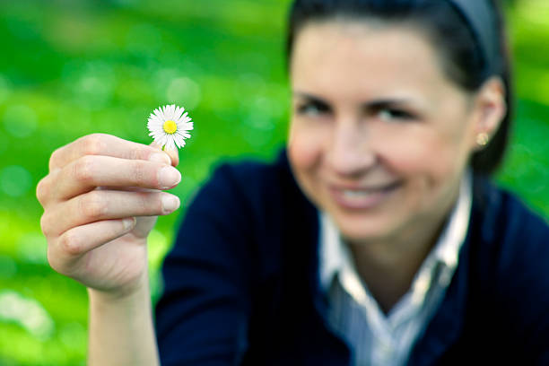 istock Young girl with flower 185311377