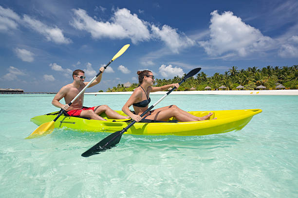istock sporty couple in kayak 185311378