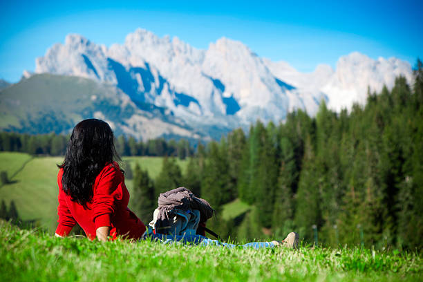 Valley in Slovenia. Green meadow in front, mountains in back.