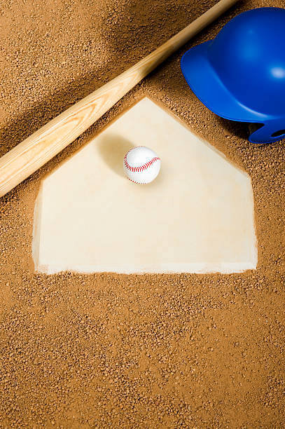 istock Baseball, bat and batter's helmet on Home Plate 185311798