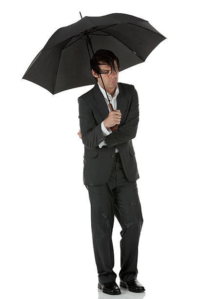 istock Wet businssman with an umbrella 185311928