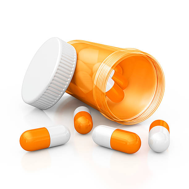 pill bottle isolated open orange pill bottle and capsules.3d render. pill prescription capsule prescription medicine stock pictures, royalty-free photos & images