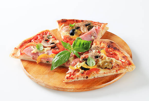 istock Slices of ham pizza with mushrooms 185312358