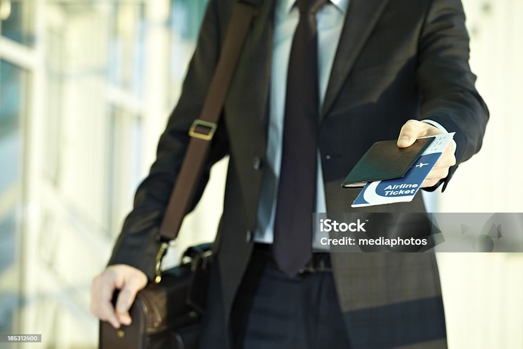 Business flight Man going to airport with tickets Airport Stock Photo