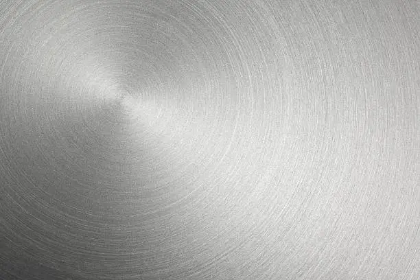 Circular stainless steel brushed background.