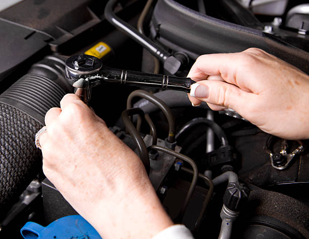 istock Woman Repairing Engine 185312618