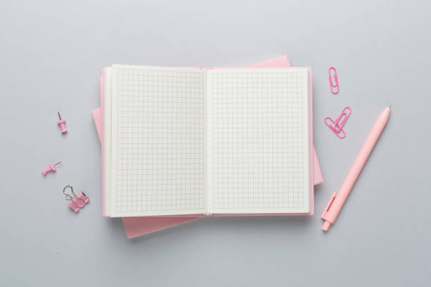 istock Notebook with stationery on color background, top view 1853130366