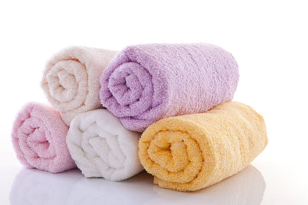 Rolled Up Bath Towels Rolled up bath towels on the white background. terry towel stock pictures, royalty-free photos & images