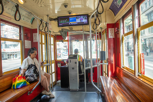 New Orleans, USA - October 25, 2023: people in New Orleans use the street car in early morning to go to town and work.