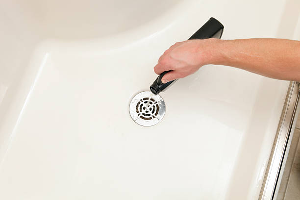 istock Unclogging Shower with Liquid Drain Cleaner 185313890