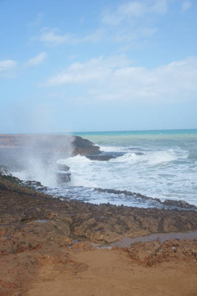 istock Waves splashing on cliffs in Cabo de la Vela, La Guajira, Colombia 1853166398