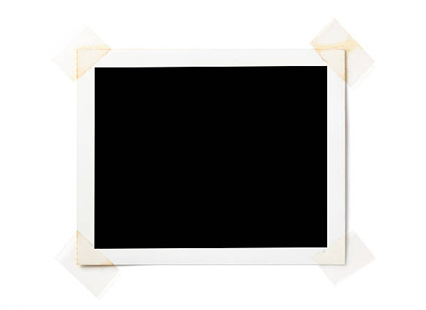 Blank photo on white Blank photo with clear tape isolated on white Background. adhesive tape photos stock pictures, royalty-free photos & images